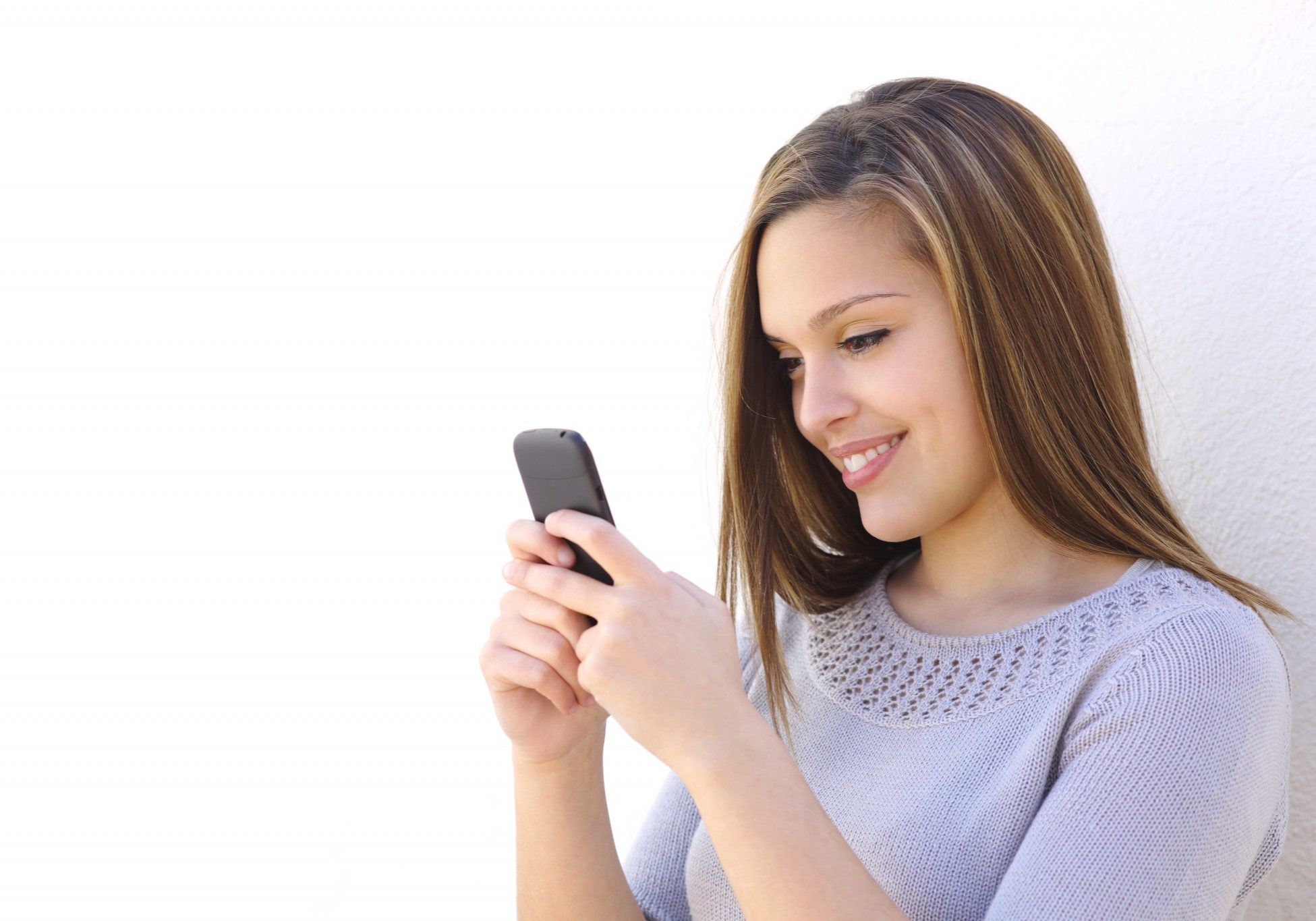 bigstock-happy-woman-texting-on-a-smart-61619678